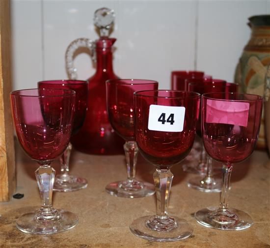 A cranberry glass decanter and nine similar glasses, one marked Lewes New Station Inn(-)
